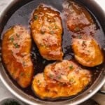 honey garlic chicken in a pan with sauce.