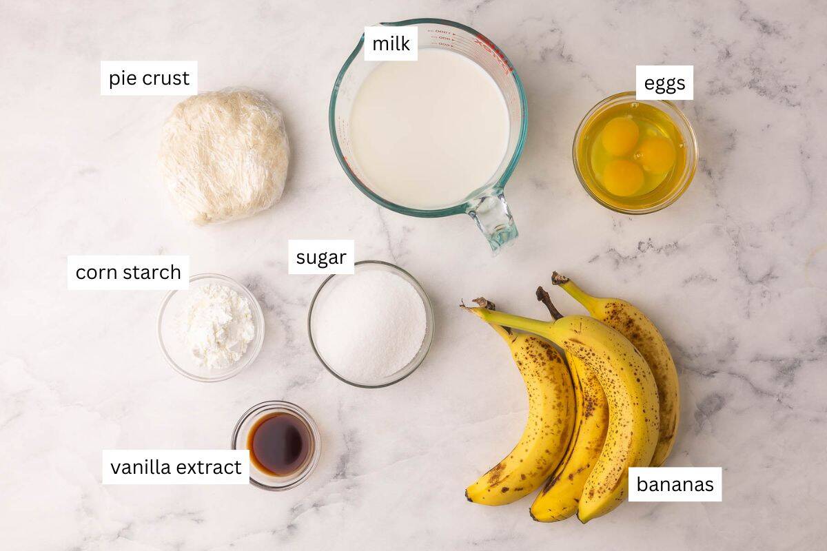 Banana Cream Pie is a classic, make-ahead cream pie with a flaky pie crust, thick vanilla custard, and lots of fresh banana slices, finished with a big cloud of homemade whipped cream! #banana #dessert #easter | easter dessert recipes | easy dessert recipes | homemade pie recipes | banana recipes | easter recipes | spring desserts | custard ingredients needed for banana cream pie.