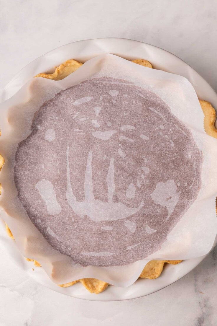 parchment added to the top of chocolate cream pie.