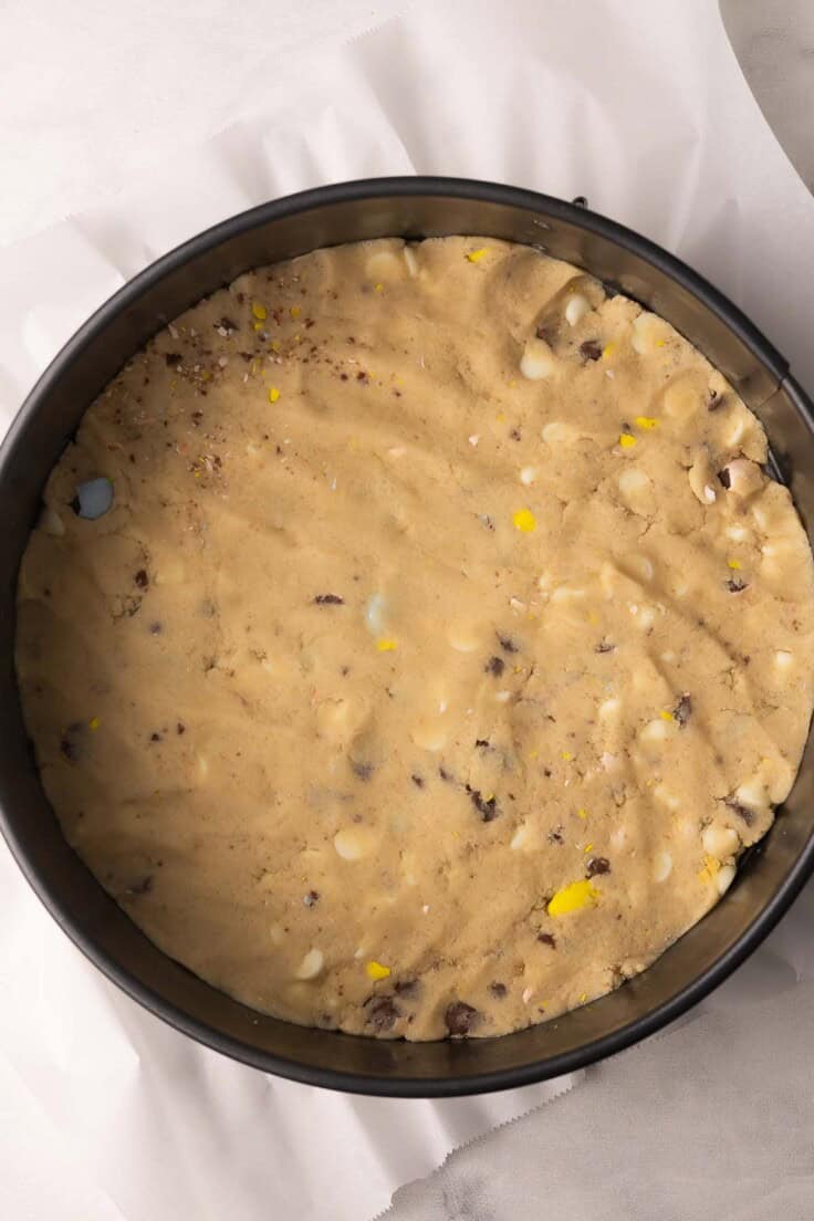 spring form pan with dough pressed in to bottom.