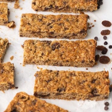 peanut butter granola bars with raisins beside.