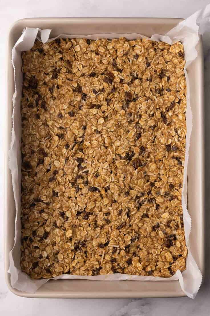 rectangular pan filled with unbaked peanut butter granola bar.