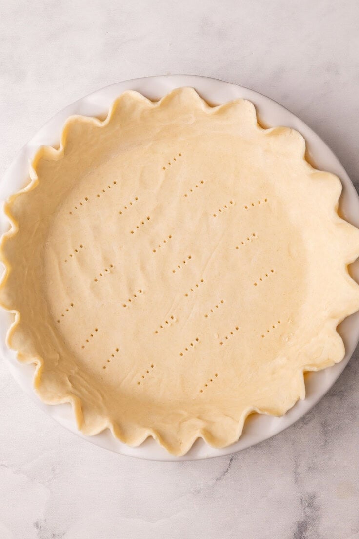 unbaked pie crust in pan ready for the oven.