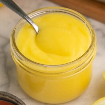 lemon curd in a glass mason jar.