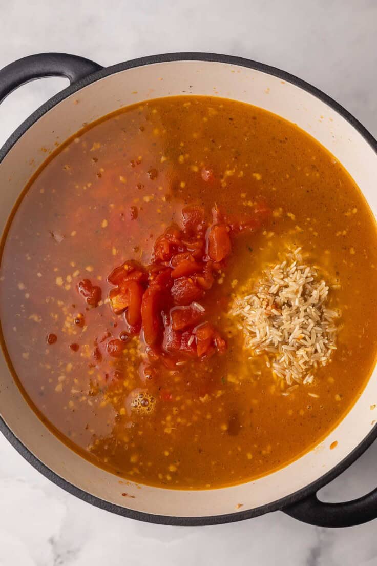 broth added to large soup pot with other ingredients.