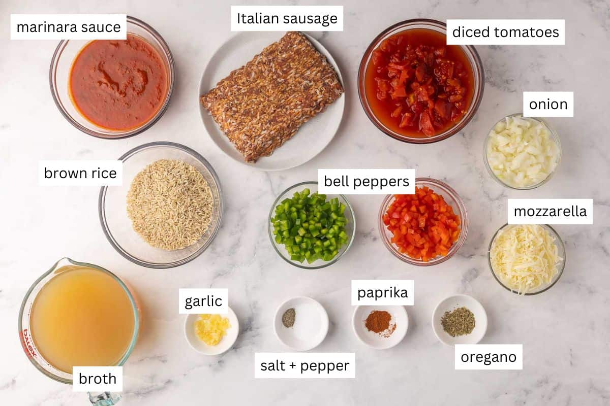 Stuffed Pepper Soup is a hearty, flavor-packed soup made with Italian sausage, bell peppers, long grain rice, and tomatoes. It’s an easy, healthy, one-pot dinner that you can make on the stove top or in a slow cooker! #soup #recipe #dinner | dinner ideas | soup recipes | easy recipes | healthy soup | healthy dinner | italian sausage | healthy dinner | soup recipe ingredients needed for stuffed pepper soup in bowls.