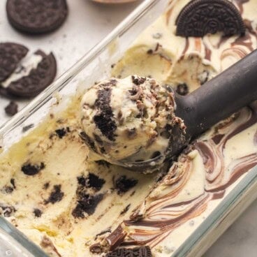 cookies and cream nutella ice cream in dish with a scoop on top.