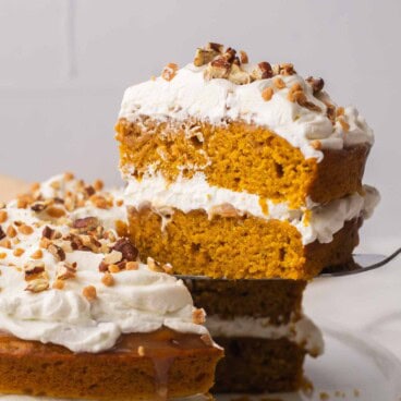 pumpkin caramel pecan cake with a slice coming out.