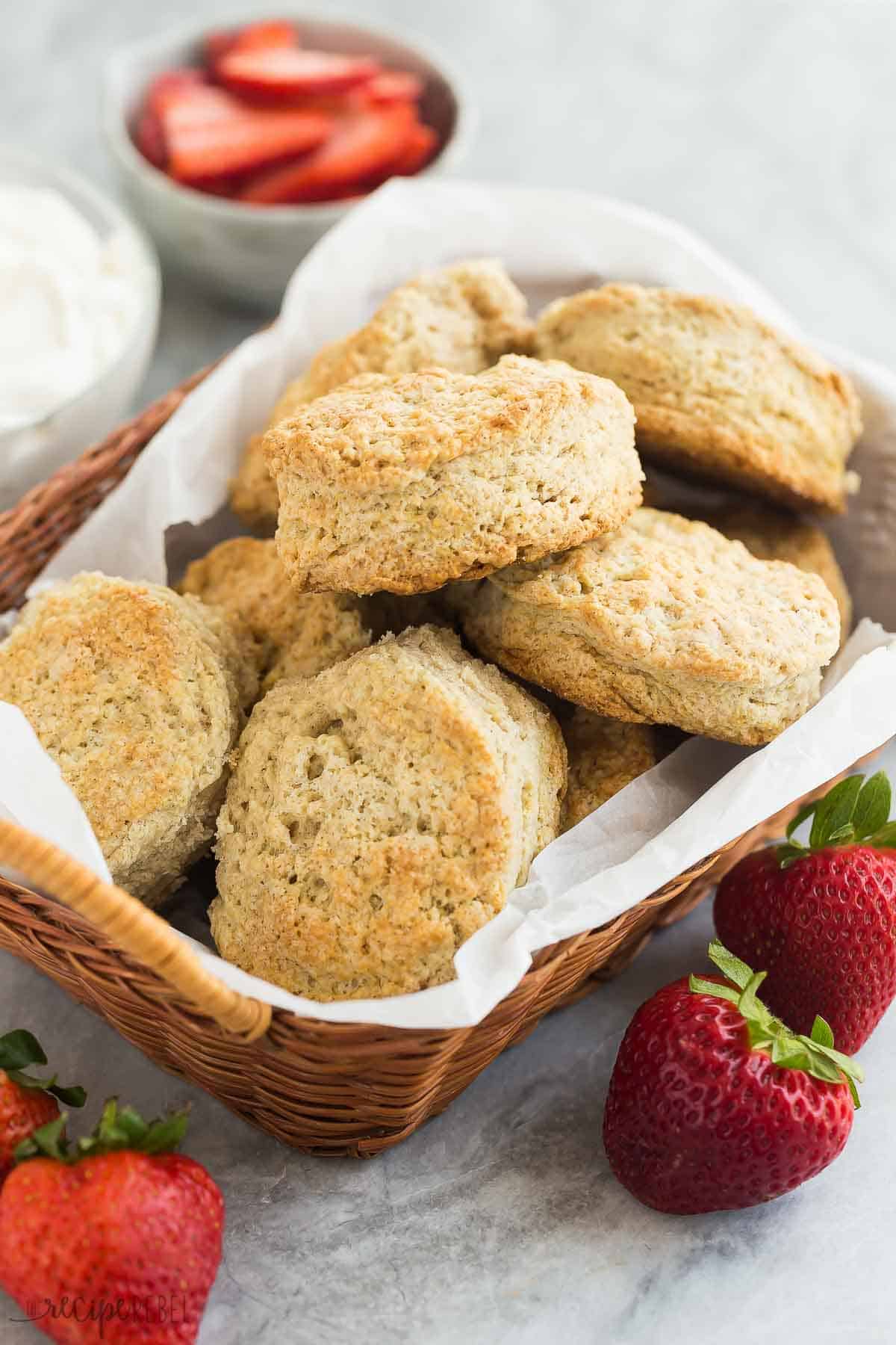 This Strawberry Shortcake recipe is made completely from scratch, but make ahead and freezer options make this an easy strawberry dessert you'll enjoy all summer long! With flaky biscuits, fresh strawberries and homemade whipped cream. #strawberry #dessert #recipe | dessert recipes | easy desserts | summer dessert | strawberry recipes | dessert recipes | baking from scratch | homemade whipped cream | make ahead basket of strawberry shortcake biscuits.