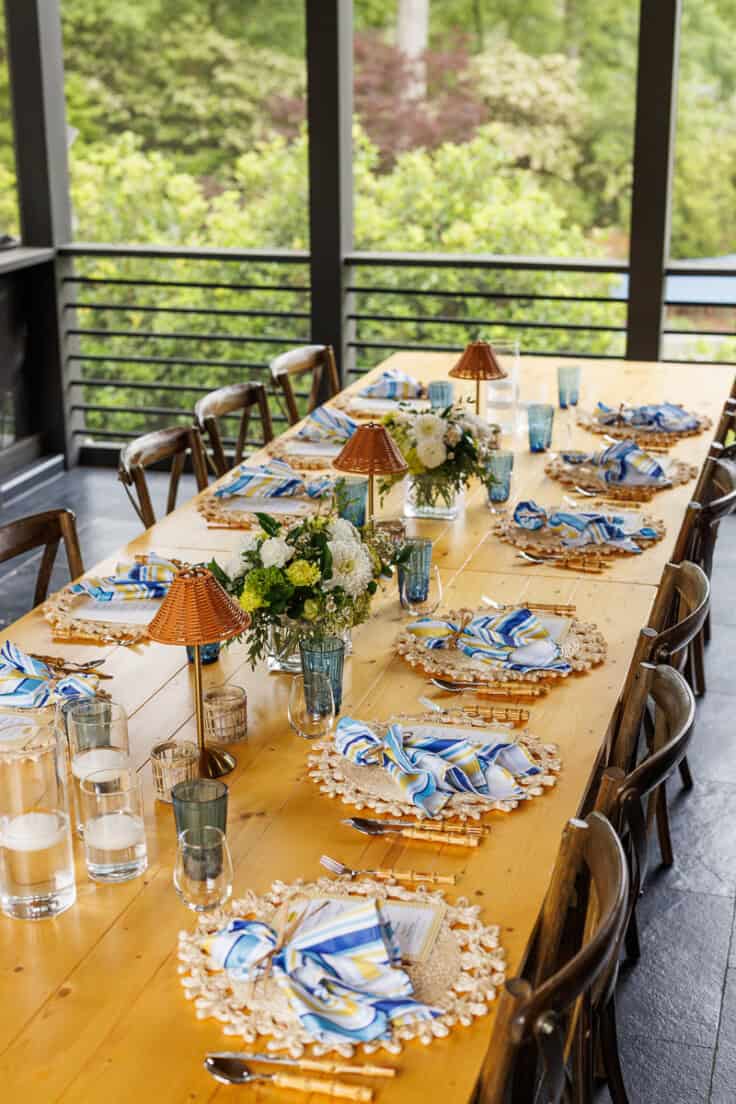tablescape on outdoor patio with blue and yellow theme.