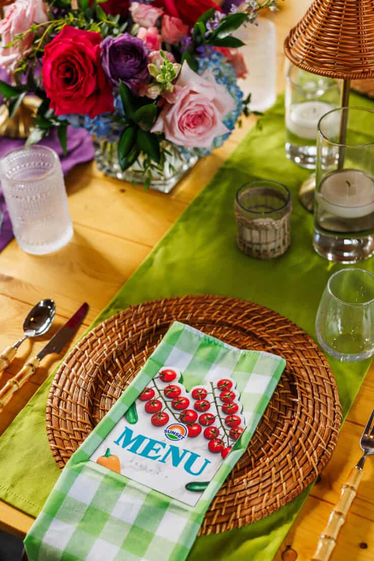 tablescape with floral arrangement and menu.