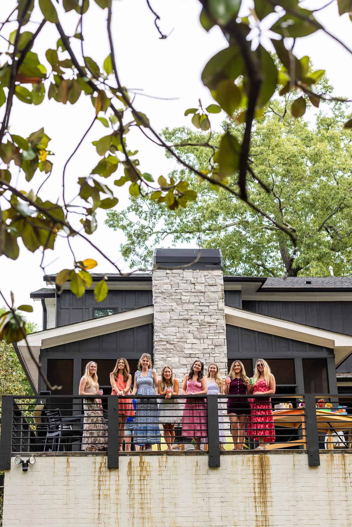 high res image of food bloggers talking on a patio.