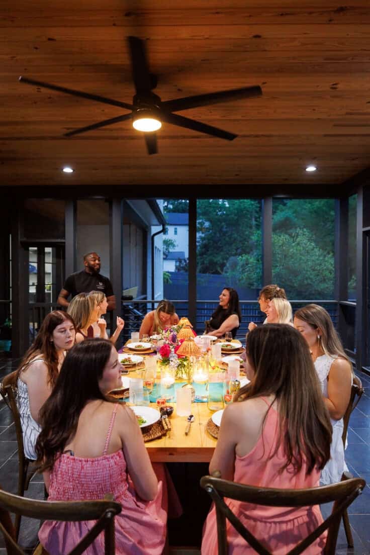 group of food bloggers talking over an evening dinner.