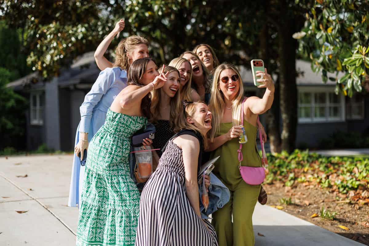 group of women taking a selfie.