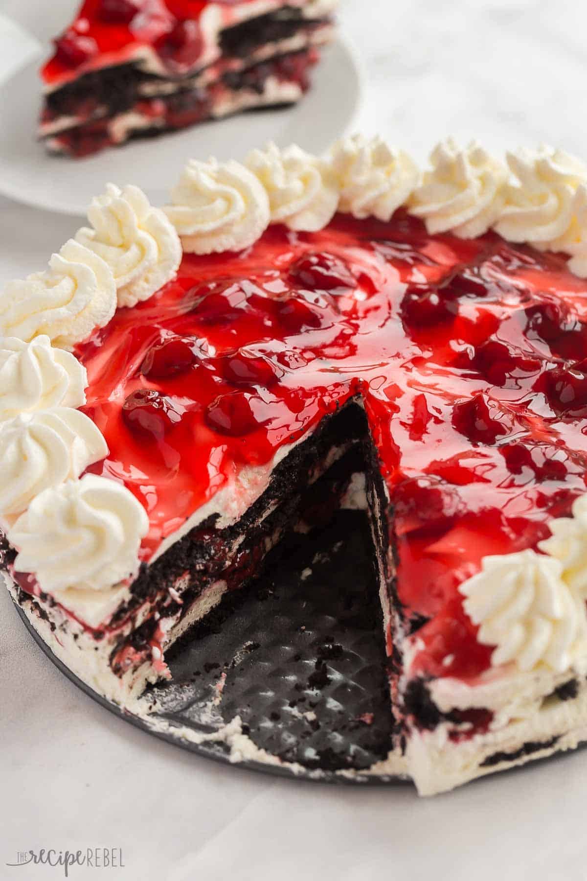 whole no bake black forest icebox cake with one piece missing.