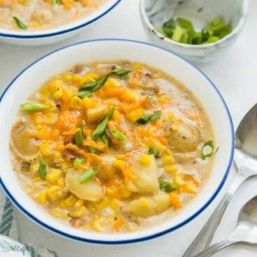 square image of a bowl of instant pot corn chowder with green onions.