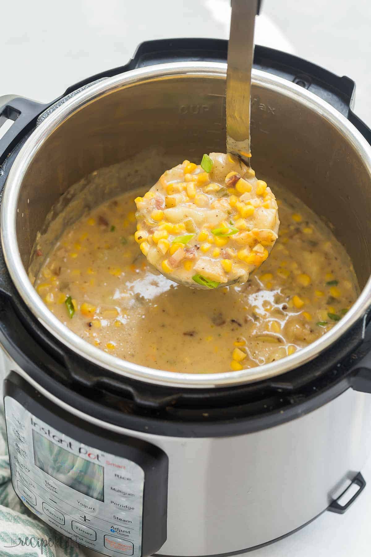 This Instant Pot Potato Corn Chowder is an easy pressure cooker soup recipe that is loaded with creamy potatoes, fresh corn, and smoky bacon. It's perfect for summer or winter! #chowder #corn #soup #recipe #instantpot #pressurecooker | instant pot soup recipes | healthy soup | potato soup | corn recipes | summer recipes | comfort food | easy dinner ideas metal ladle scooping potato corn chowder out of instant pot.