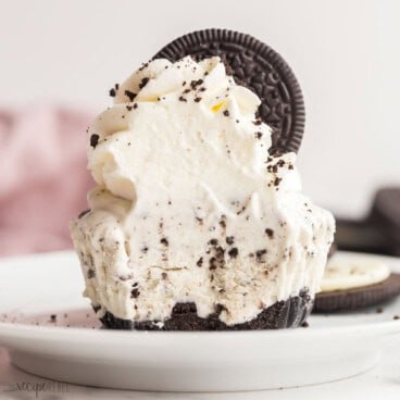 square image of oreo ice cream cupcake with bite taken out of it.